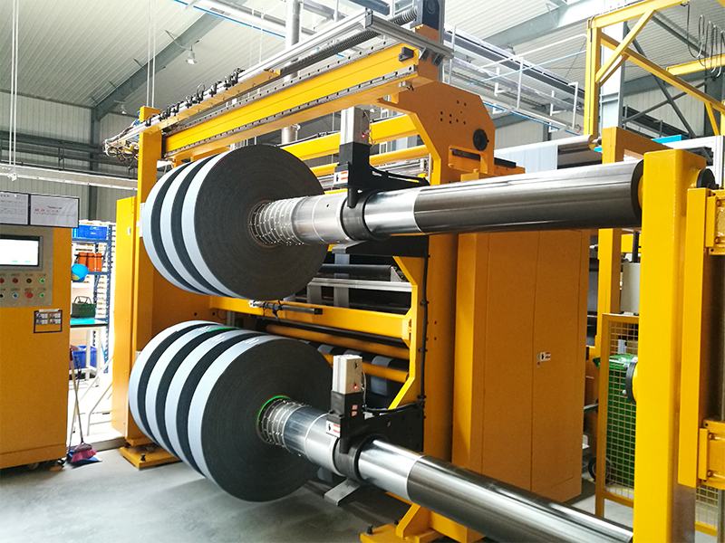 How plastic film slitter handles surface treated or coated films?